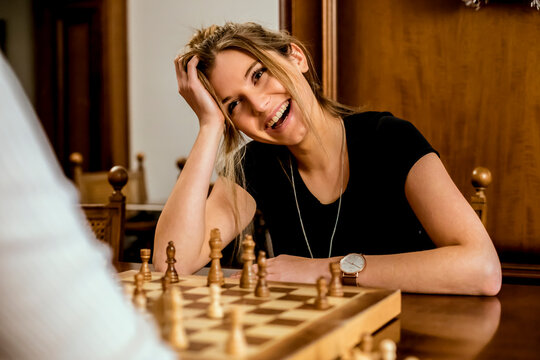 Woman having fun playing chess