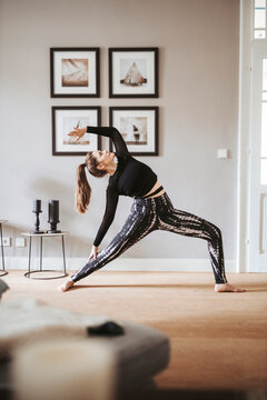 Woman practising yoga at home