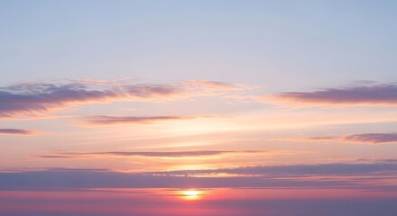 Fototapeta premium Stunning sunset over the ocean with vibrant pink, orange, and purple clouds reflecting on the water, creating a serene and breathtaking view.