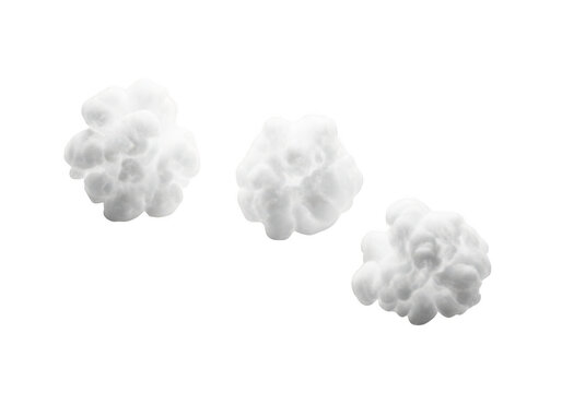 Three fluffy white cotton balls isolated on transparent background