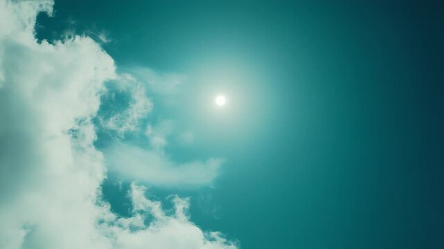 Bright sun piercing a teal tinged sky, soft ethereal clouds drifting across a tranquil daylight sceneserene, atmospheric backdrop with open airy space for copy