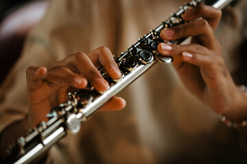 Close-up Female Musicians Playing Flute and Saxophone in Studio Rehearsal