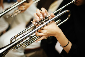Close-up Trumpet Player Practicing in a Music Rehearsal Room © maha