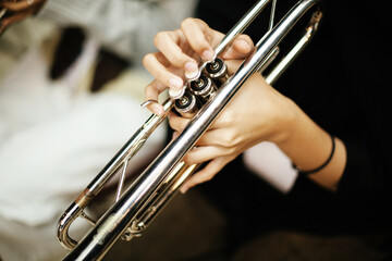 Close-up Trumpet Player Practicing in a Music Rehearsal Room © maha