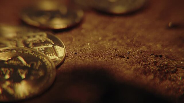 Golden bitcoin coins falling through the air against a dark background, symbolizing cryptocurrency market crash, financial volatility and investment risk
