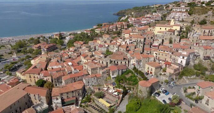Aerial view of the town of Scalea, located in the province of Cosenza, Calabria, Italy. The historic center is perched on a hill overlooking the Tyrrhenian Sea.
