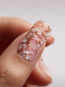 Close-up exploration of a delicate brittle nail showcasing intricate textures and colors