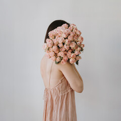 Woman Holding Pink Rose Bouquet. Love, wedding planning, or romantic advertisement