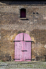 Old dock building with pink door, Poplar, Tower Hamlets, London, E14, England, UK