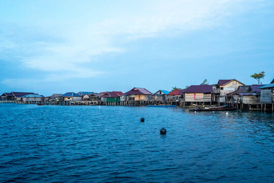 Fishermen houses at sunset, Pulau Papan, Malenge, Sulawesi, Indonesia