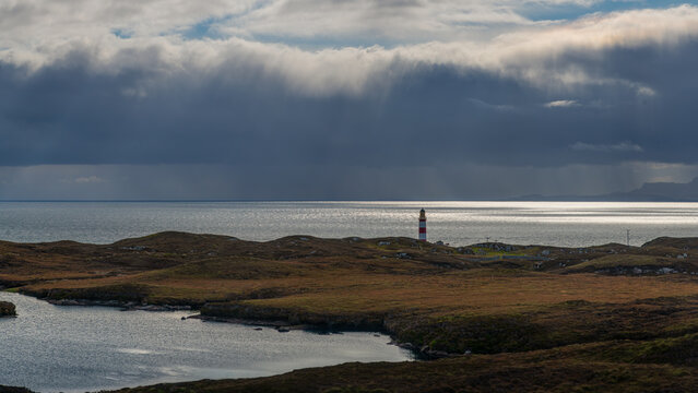 the red and white Eilean Glas Lighthouse on the east coast of the island of Scalpay in the Outer Hebrides, Scotland, UK