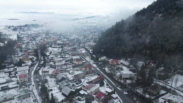 Aerial view of Blatnica Village - Valley in Velka Fatra mountains in Slovakia, winter landscape, 4K, ProRes