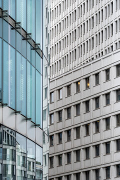 Abstract modern urban architecture building facade with glass windows and concrete pattern showing geometric lines and minimal perspective