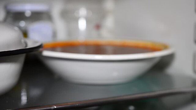 espresso coffee in a cup. Various Products In Refrigerator On Shelf Hand Man Bert Product Has Movement Close-Up