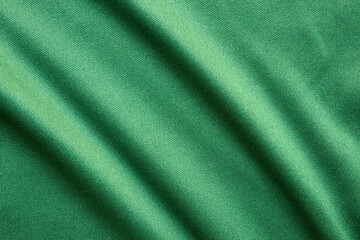 Fototapeta premium Green sports clothing fabric football shirt jersey texture close up
