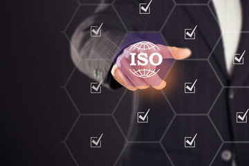 Fototapeta premium ISO standards quality control, assurance and warranty business technology concept. Touching on screen with ISO and globe icons on smart background. ISO Standard certification. Modern ISO banner.