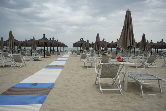 Beach in Giulianova, Italy, sandy shore, calm sea, peaceful atmosphere, seaside, summer, relaxation, vacation, outdoor view.