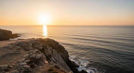 Golden Sunset Over Rugged Coastal Cliffs and Serene Ocean Waves.