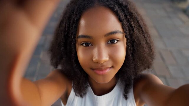 African american teenage girl taking a selfie video