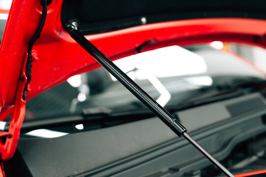 Gas bonnet strut of a new red vehicle