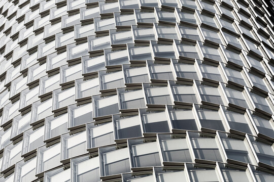 Modern urban architecture facade with curved pattern texture and repetition in detailed abstract background design for creative projects