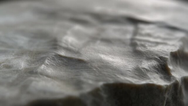 Closeup of gray crumpled paper texture background.