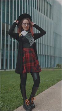 Stylish young student posing outdoors at university campus