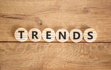 Trends trend word symbol. Concept word Trends on beautiful wooden circles. Beautiful wooden background. Business trends trend word concept. Copy space.