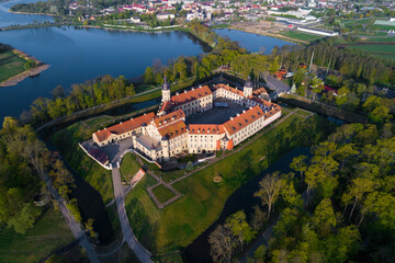 Aerial view of the ancient Nesvizh Castle on a sunny May day (shot from a quadcopter). Nesvizh, Belarus