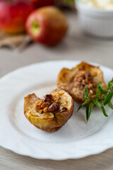 Warm homemade baked apples topped with walnuts and cinnamon