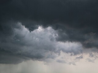 Obraz premium Dark dramatic storm clouds and approaching rain. Creating a moody and dramatic atmosphere