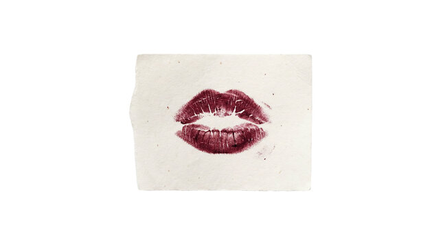 Dark red lipstick kiss mark on a small textured paper scrap, isolated on transparent background.