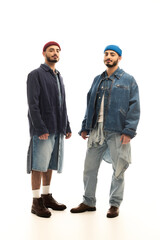 Stylish twin brothers showcasing unique fashion sense in modern attire