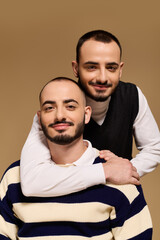 Obraz premium Stylish twins showcase brotherly bond in an elegant photo session