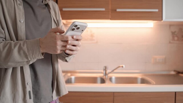 Apple iPhone 17 Pro Max in hands of man at home