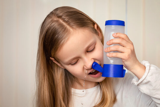 Nasal Shower or Nasal Irrigation way to relieve Blocked nose by Rinsing out mucus, allergens, and Irritants with Saline solution. Nasal Sinus washout at Home. Sinus Rinse with neti pot.