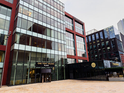 Modern glass office building in Manchester city center UK at One Tony Wilson Place