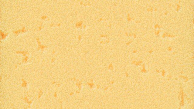 Yellow porous sponge texture background featuring soft foam surface for cleaning or insulation concepts