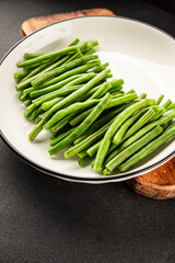 Green beans raw fresh vegetable string bean healthy food ingredient appetizer fresh tasty gourmet  table setting food background on the table rustic top view copy space keto and paleo diet 