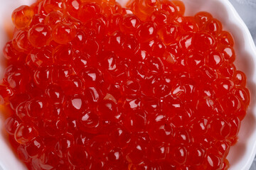  fresh red  salmon caviar with lime around ice. macro shot.  Protein delicacy  healthy food
