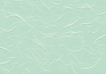 Obraz premium A light green textured background with a subtle pattern.