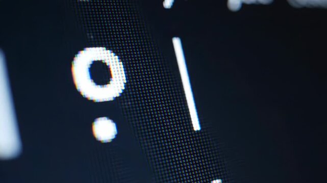 Close-up of White Percent Symbol and Vertical Line on Dark Digital Screen