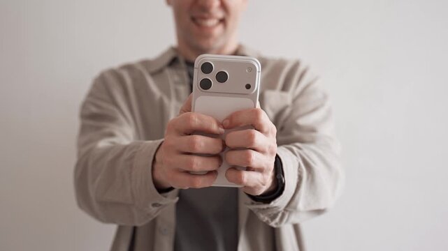 Man Using Apple iPhone 17 Pro Max Indoors