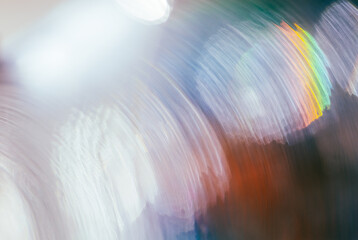 Abstract spectral background from light leak defocused colorful bokeh. Glowing backdrop with sunlight overlay effect for your technological design.