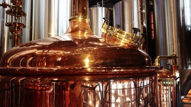 Large industrial brewery factory with copper and steel equipment for craft beer..