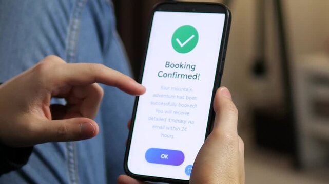 The decisive click that unlocks adventure. This close-up captures the exciting moment a traveler confirms a mountain tour booking on their phone, followed by instant success confirmation. 
