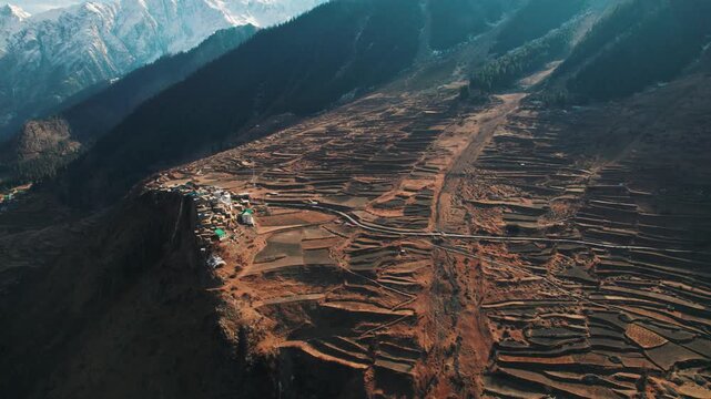 4K Aerial shot of Triloknath village which is build on cliff of mountain at Lahaul, Himachal Pradesh, India. Fairytale small village in serene Himalaya mountains. Autumn landscape.