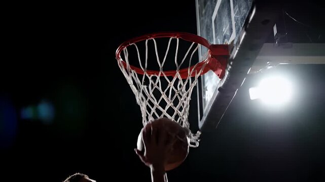 Dramatic Basketball Action at Night