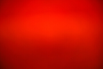 Abstract luxury red gradient background. Vibrant scarlet blurred texture for Christmas, Valentine's Day, or Chinese New Year. Elegant smooth crimson backdrop for banner, poster, and presentation © ISENGARD
