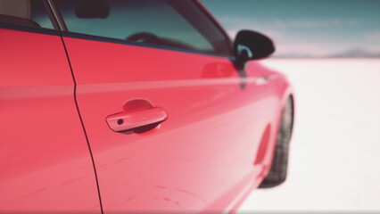 A striking red car stands against the vast expanse of white salt flats, reflecting sunlight under a bright blue sky. The scene captures the essence of a serene, open landscape. © icetray